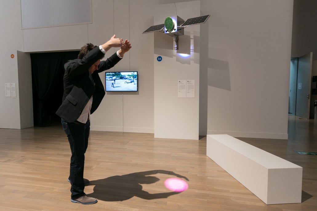 Professor Roland Graf demonstrating of trying to hold the pong spot using his shadow.